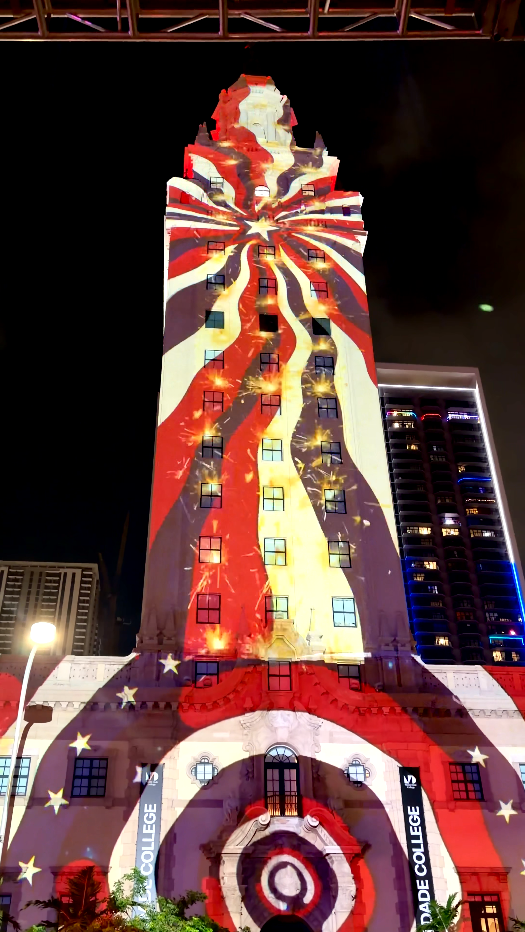 Red, white and blue fireworks animation covering Miami’s Freedom Tower