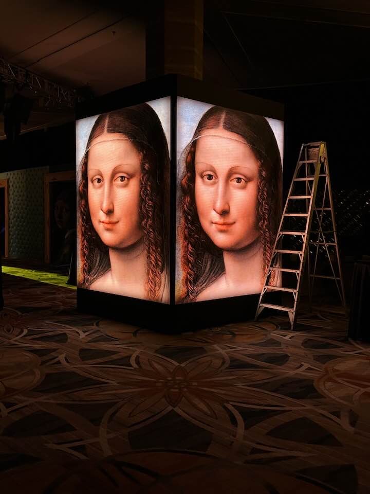 Illuminated portrait display being installed for a Make-A-Wish Ball production