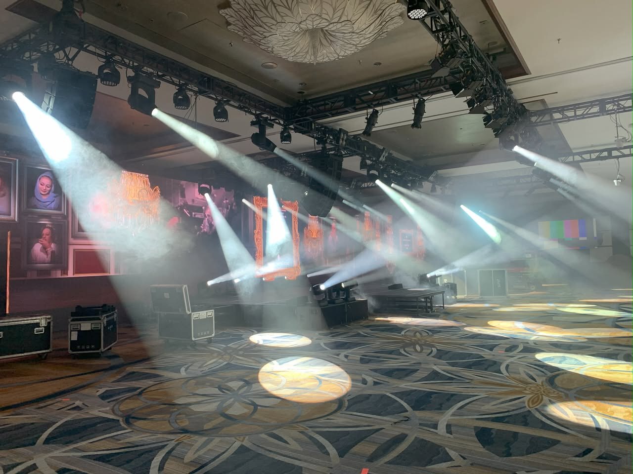 Gallery-inspired digital content and theatrical lighting during event setup