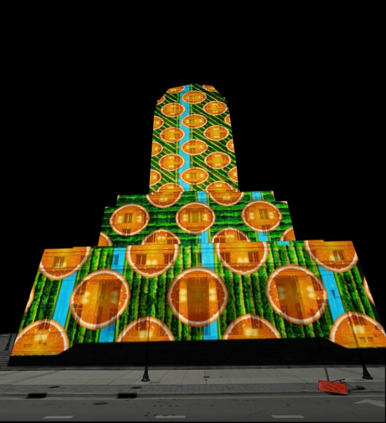 Orange-pattern projection test across the courthouse facade